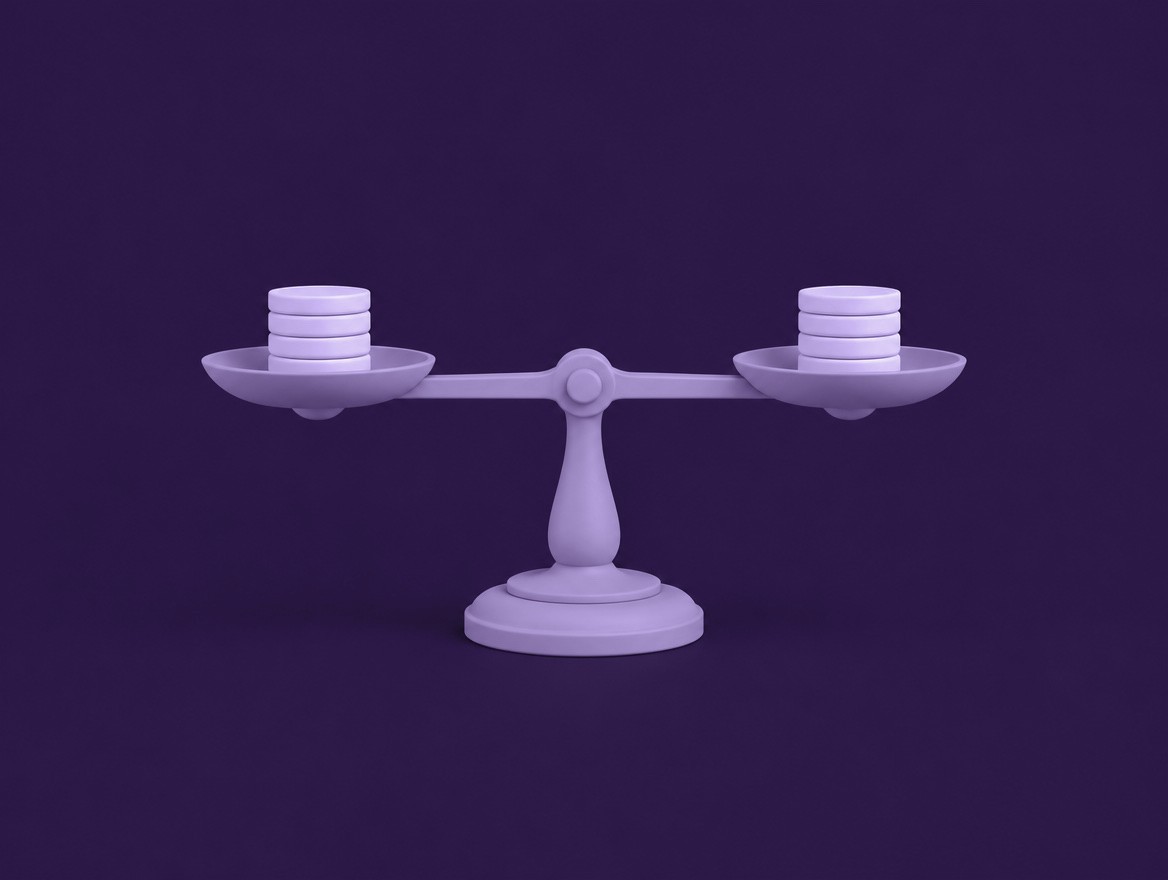 A level balance scale with an equal stack of coins on each side
